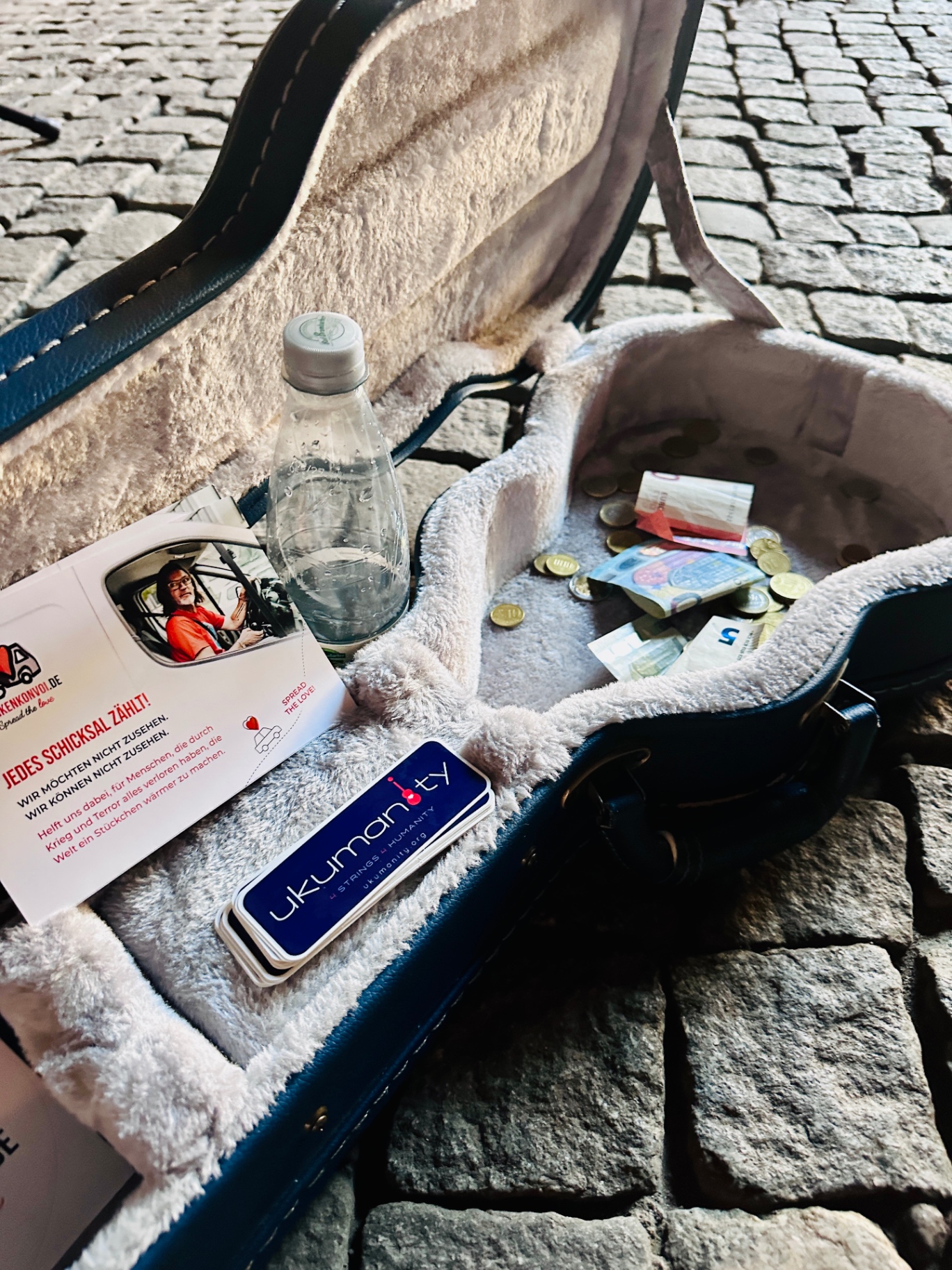 Donations collected in an ukulele case for Frankenkonvoi